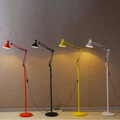 Cone shade tilted down to aim task light onto a reading surface
