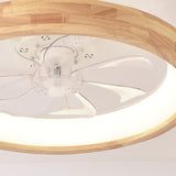 Detail of solid wood grain around the round ceiling fan light rim
