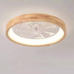 Wood flush mount ceiling fan light seen from below while lit