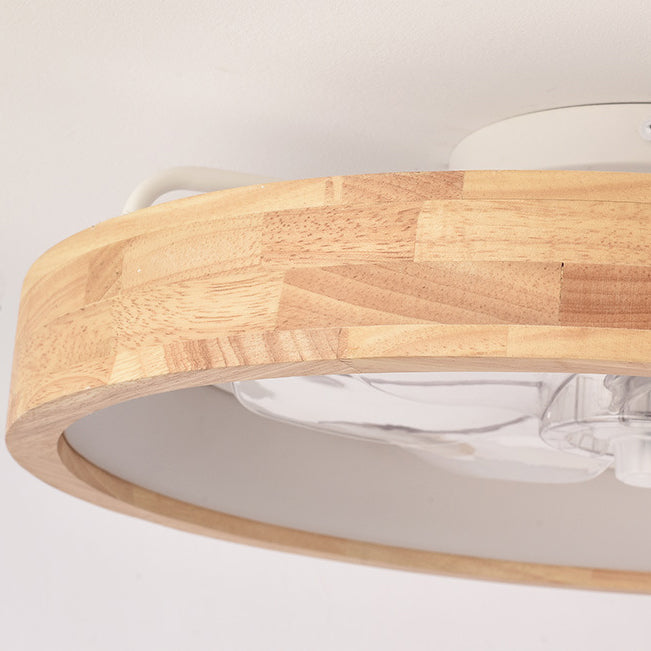 Wood ceiling fan light lit and mounted flush to a white ceiling