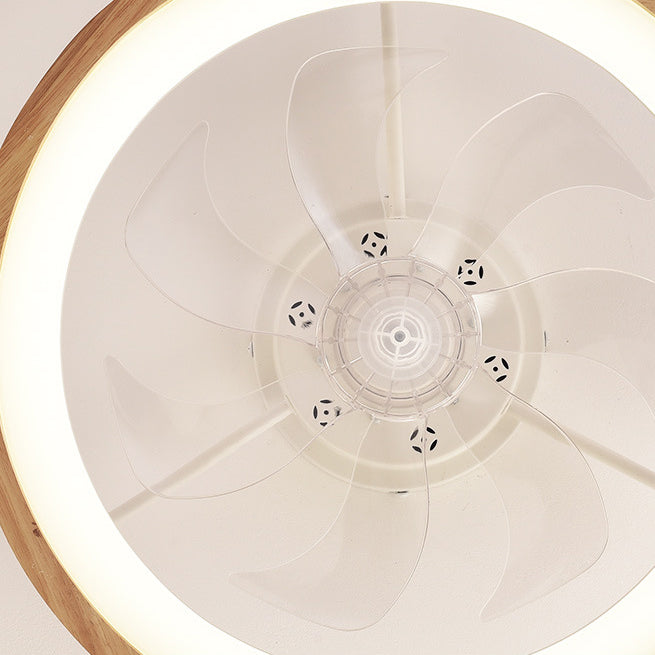 Ceiling fan light showing five clear blades and warm LED glow
