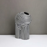 Black and white striped vase with modern geometric design