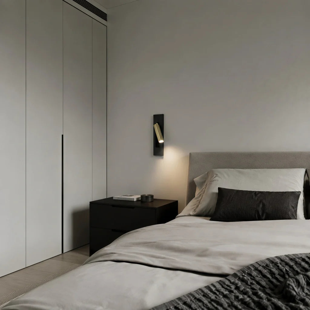 Slim rectangular backplate reading light shown against a plain wall