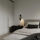 Slim rectangular backplate reading light shown against a plain wall