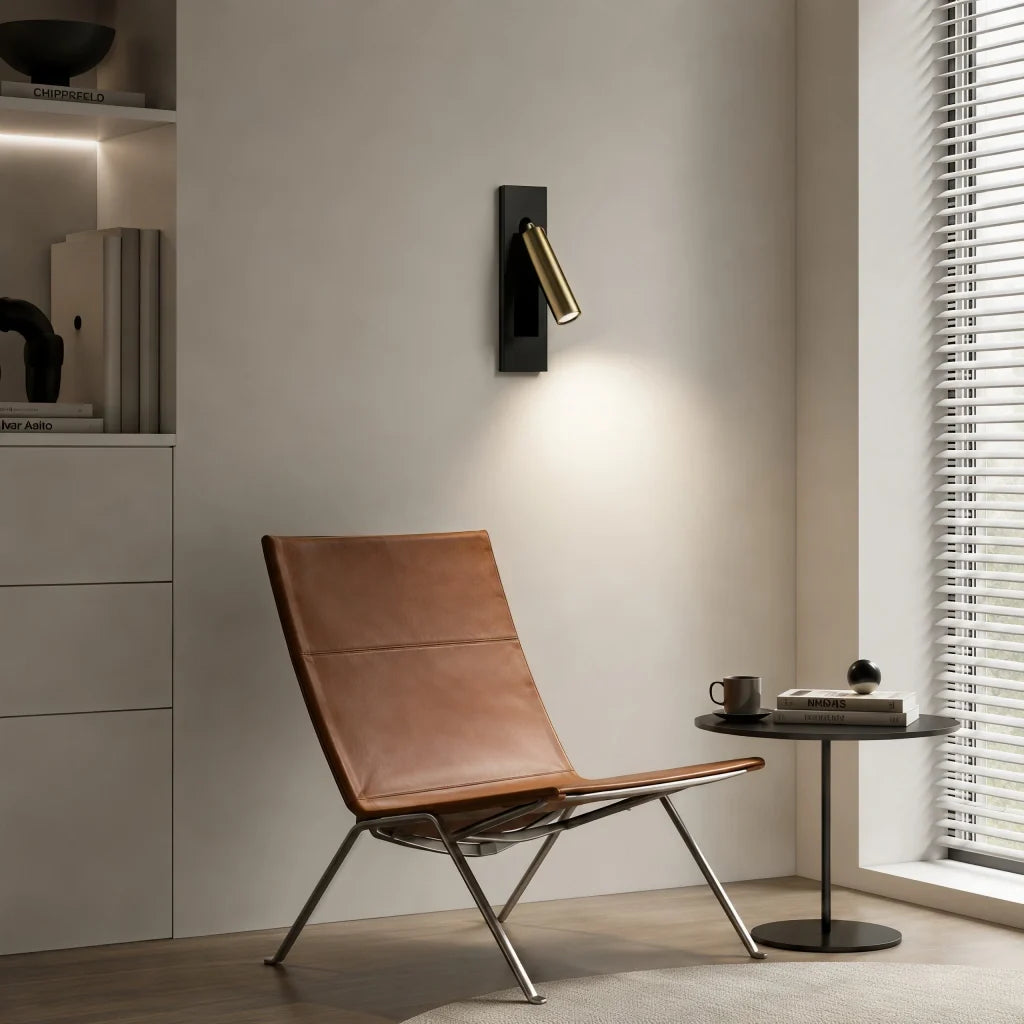 Rotating wall sconce head tilted downward to direct light onto a nightstand