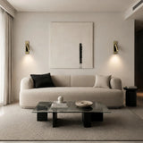 Adjustable LED reading sconce swivelled to the side for aimed lighting