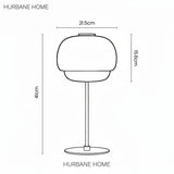 Black line drawing of a table lamp on a white background with dimension labels showing 21.5 cm width, 15.