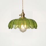 Tulip glass pendant light on a plain studio background