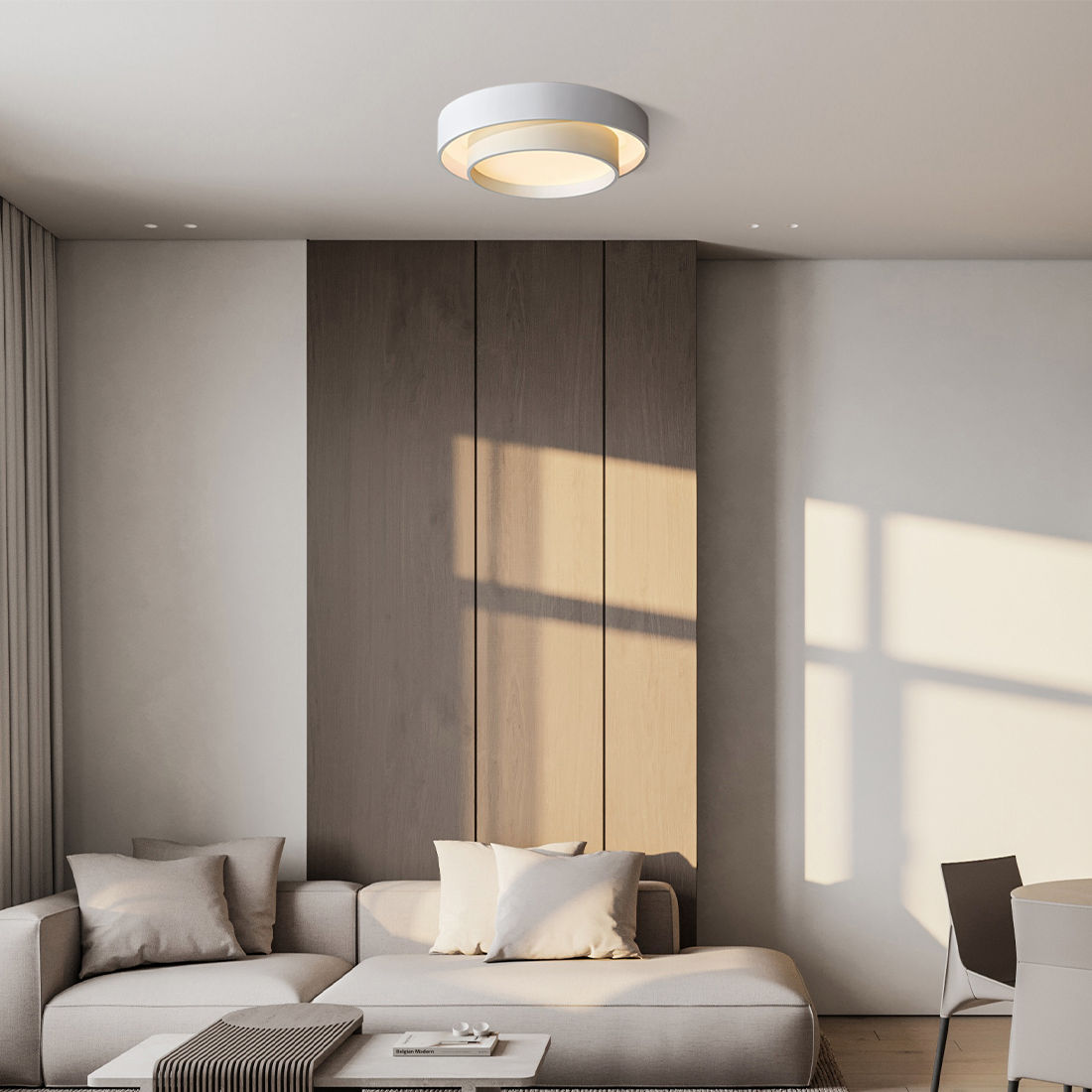 Disc ceiling light lit in a warm tone