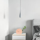 Aluminium water drop pendant light against a soft neutral backdrop