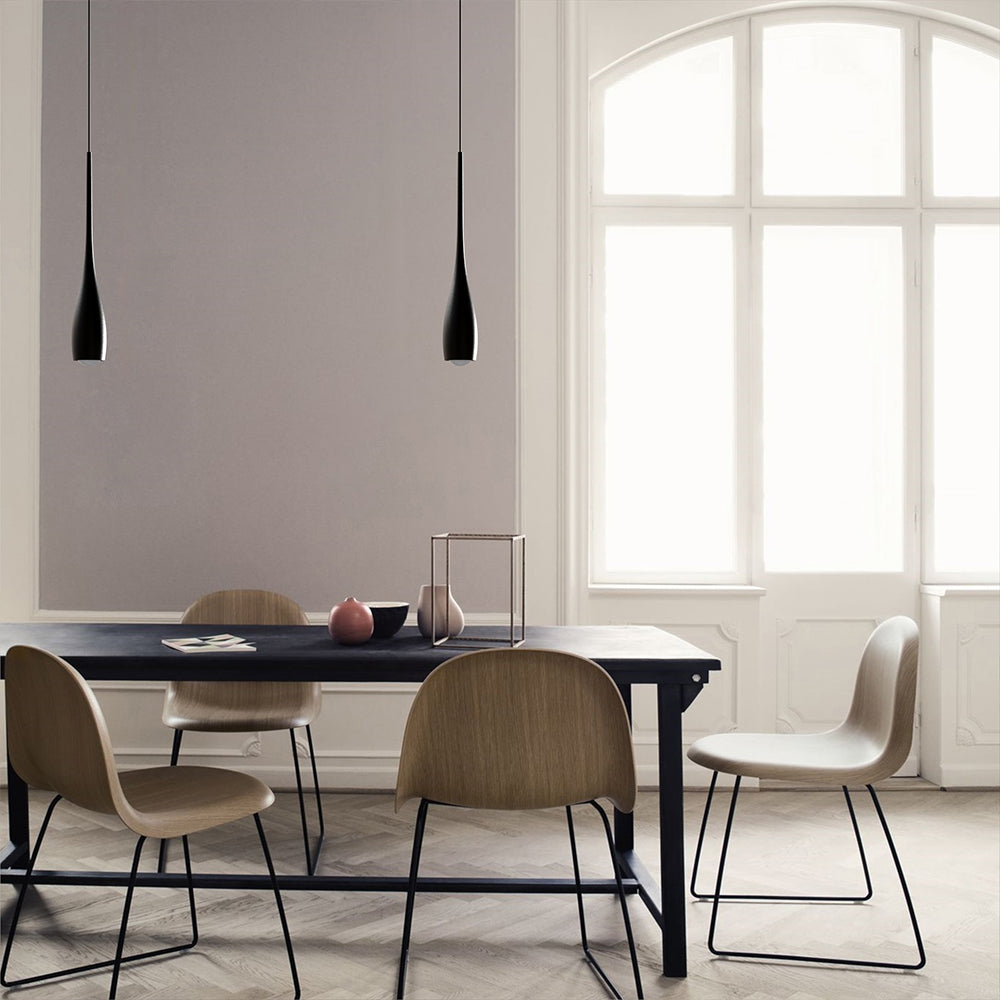 Teardrop pendant light lighting a calm neutral dining space