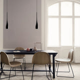 Teardrop pendant light lighting a calm neutral dining space