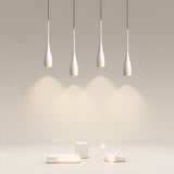 Teardrop pendant light grouped as a decorative lighting arrangement