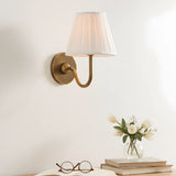Brass-finish wall sconce with softly pleated fabric shade for indoor walls, sage green shade close-up 8
