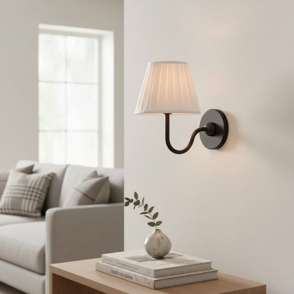 Rustic indoor wall sconce lit to show the warm glow through the linen shade, red shade front view 11