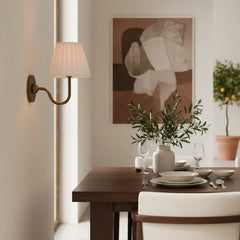 Rustic metal wall sconce with pleated shade against a neutral backdrop, dusty blue shade lit shot 15