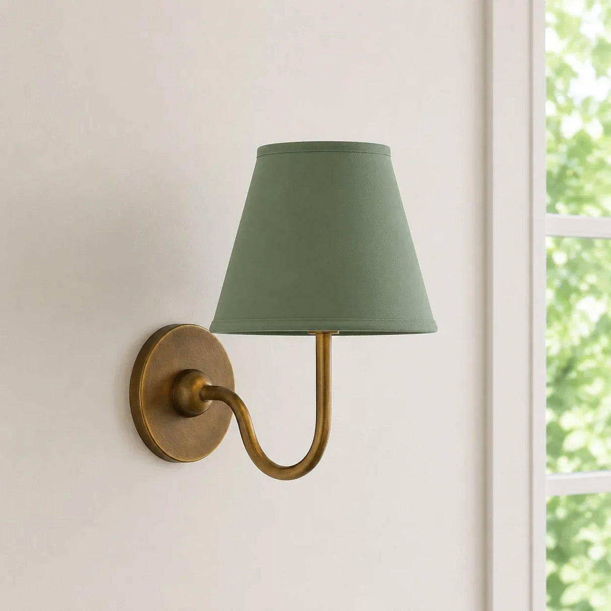 Close view of the pleated fabric shade and diffused warm light on the sconce, red shade lit shot 5