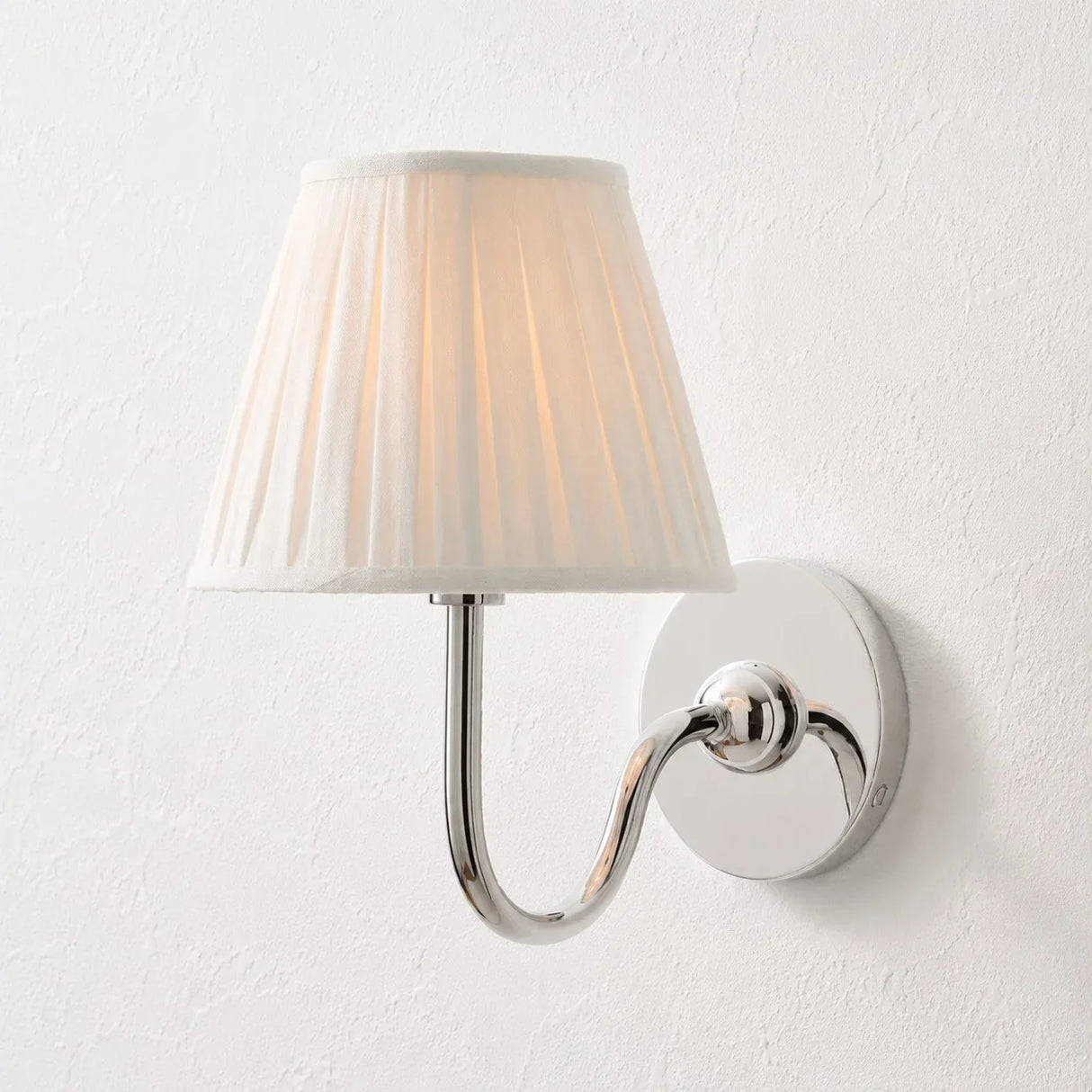 Rustic metal wall sconce with pleated shade against a neutral backdrop, green shade catalogue image 30
