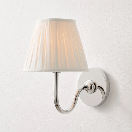 Rustic metal wall sconce with pleated shade against a neutral backdrop, green shade catalogue image 30