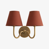Detail of the round backplate and curved arm on the pleated fabric sconce, green shade side view 42