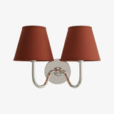 Rustic pleated fabric wall sconce with curved metal arm and round backplate, mustard yellow shade styled shot 46
