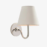 Brass-finish wall sconce with softly pleated fabric shade for indoor walls, sage green shade close-up 38