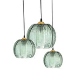Green palm leaf glass pendants shown together in three combined diameter sizes