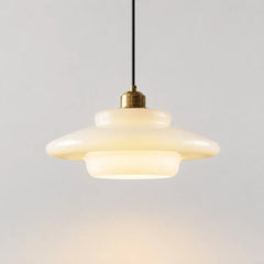 Cream opal glass pendant light on a plain background
