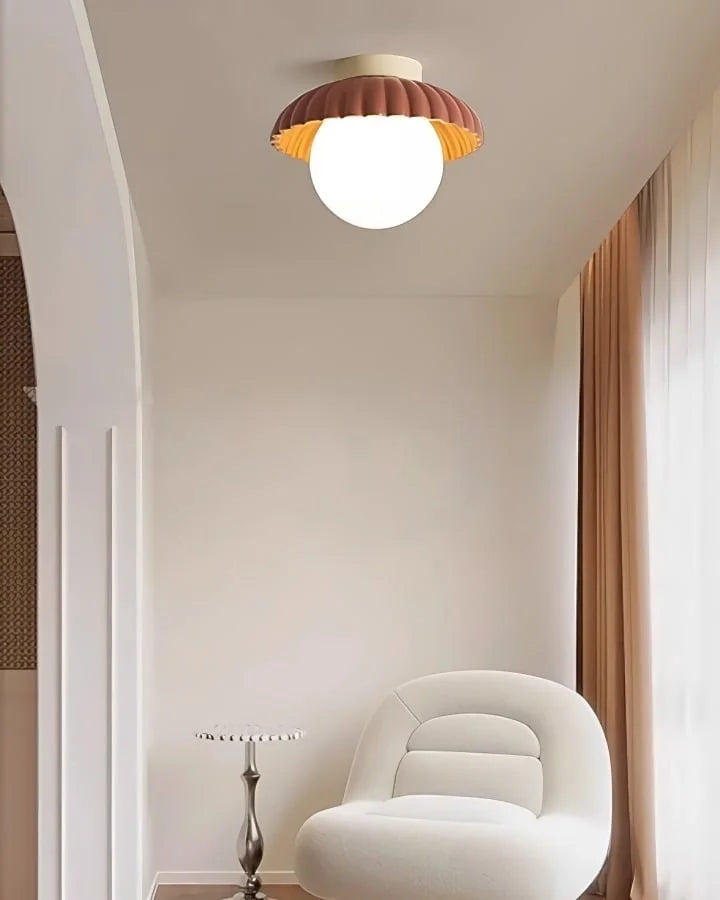 Flower-bud ceiling light showing the two-tone shade and glowing globe