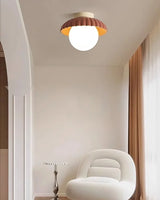 Flower-bud ceiling light showing the two-tone shade and glowing globe