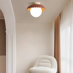Flower-bud ceiling light showing the two-tone shade and glowing globe