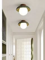 Side profile of the compact ceiling light with opal glass globe