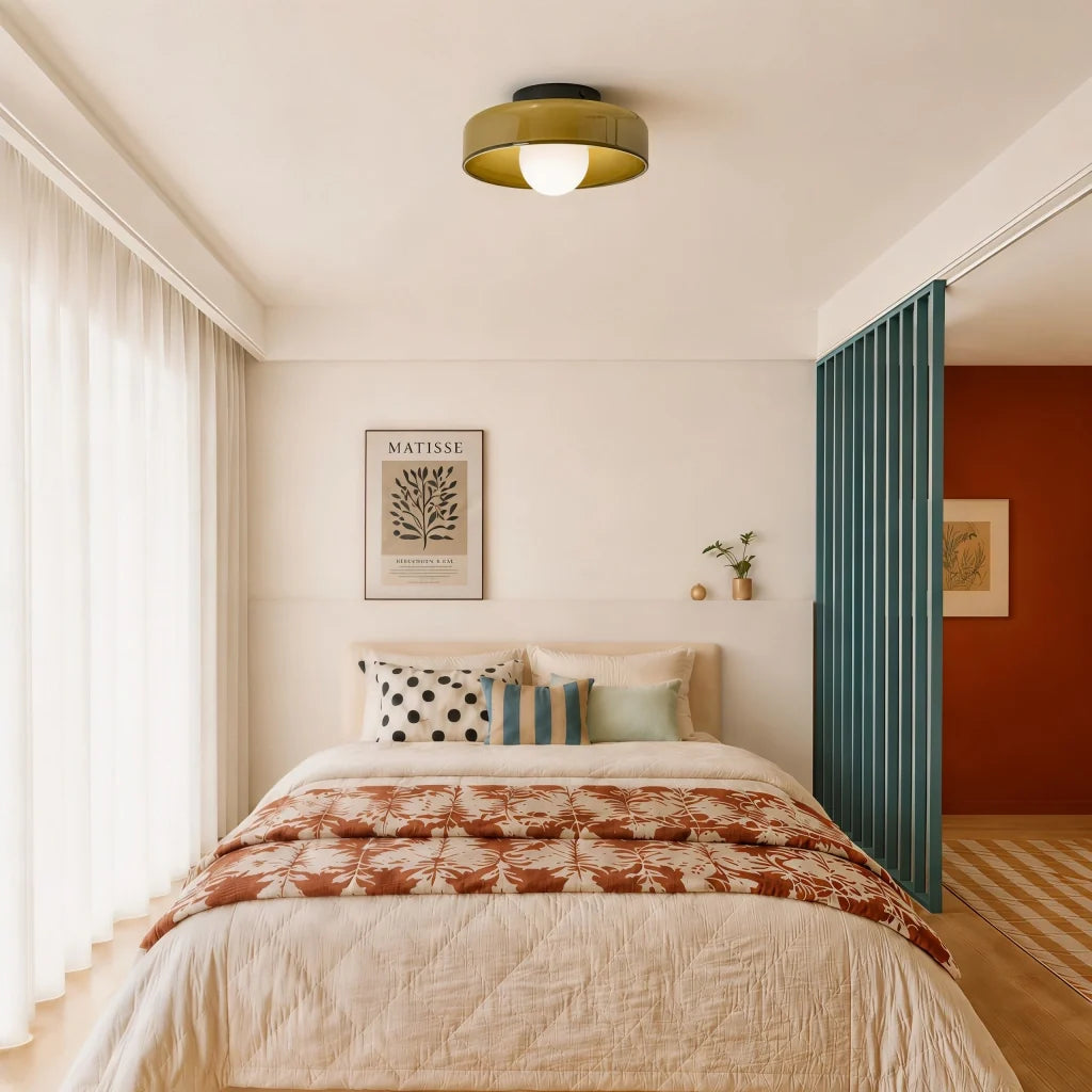 Glass disc light mounted flat on a wall