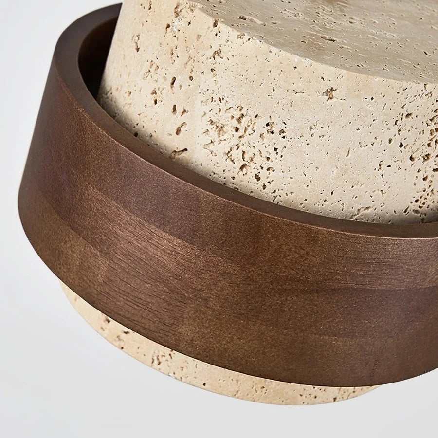 Detailed texture of the porous travertine surface on the ceiling light