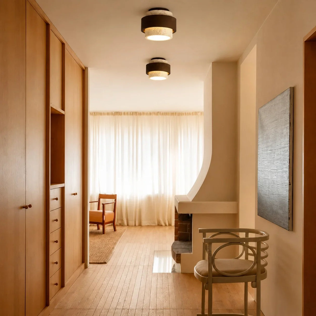 Front view of natural yellow travertine cylindrical ceiling fixture