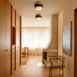 Front view of natural yellow travertine cylindrical ceiling fixture