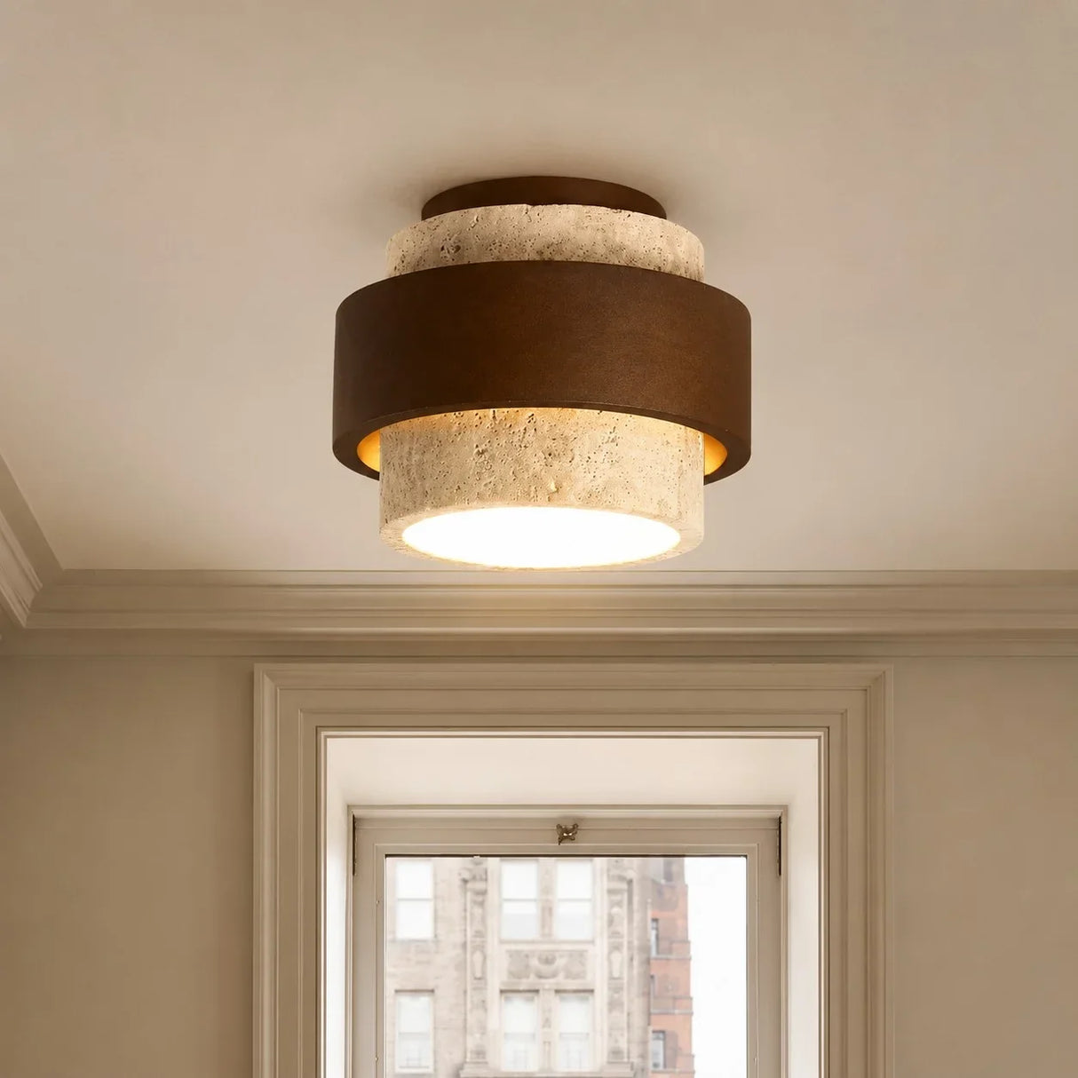 Wabi-sabi travertine ceiling light with visible stone pores and veining