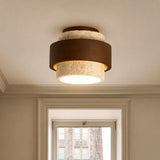 Wabi-sabi travertine ceiling light with visible stone pores and veining