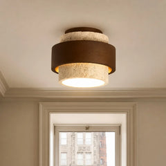 Wabi-sabi travertine ceiling light with visible stone pores and veining