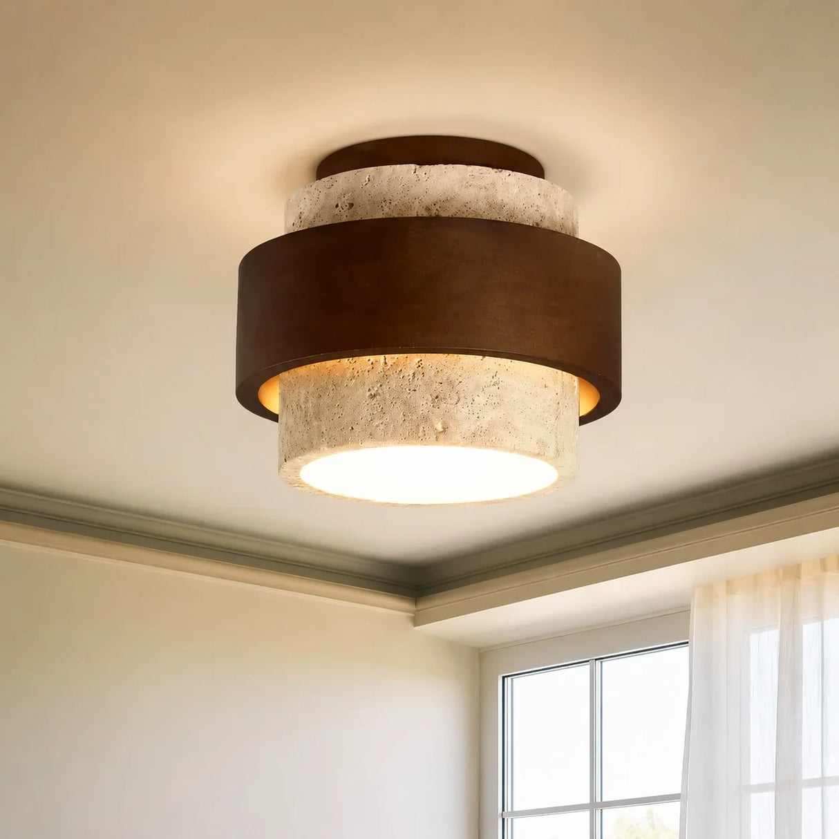 Cylindrical travertine ceiling light showing textured stone surface and warm glow
