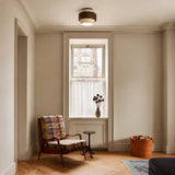 Travertine ceiling light illuminated to show warm ambient stone glow