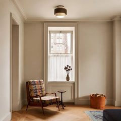 Travertine ceiling light illuminated to show warm ambient stone glow