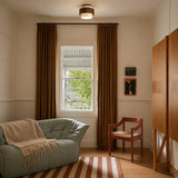 Angled view of the stacked travertine and wood ceiling light bands