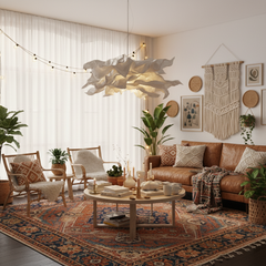 Paper pendant light over a boho living room with rattan chairs and rugs