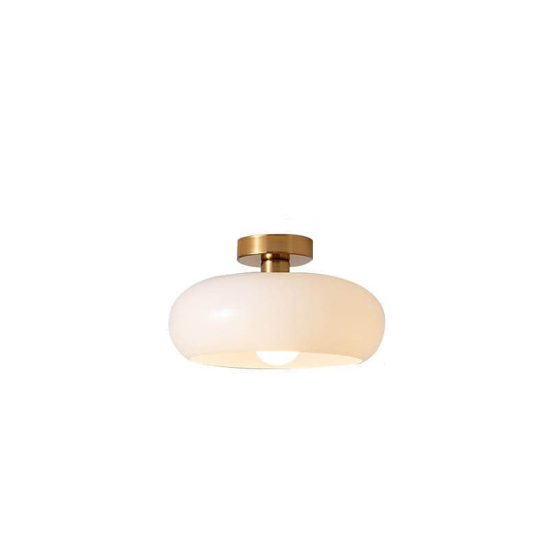 Opal white glass ceiling light shade against a plain studio background