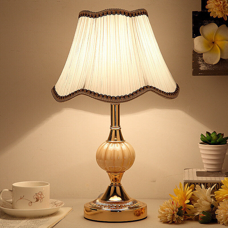 Gold fluted glass table lamp with pleated bell fabric shade
