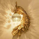 Green peacock wall sconce with crystal ball shade shown on a white background