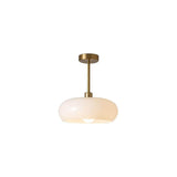 Amber glass pendant light shown at a three-quarter angle