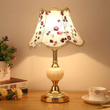 Gold base lamp with purple and burgundy floral print shade