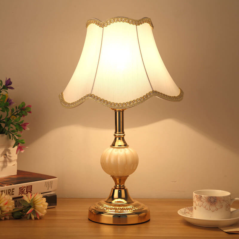 Gold base vintage table lamp with plain scalloped cream shade